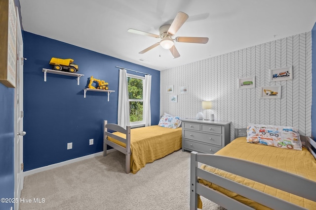 carpeted bedroom with baseboards, a ceiling fan, and visible vents