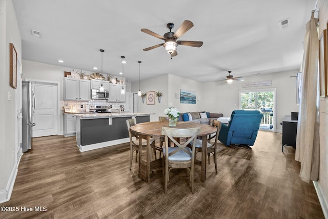 dining room with recessed lighting, visible vents, ceiling fan, and dark wood-style floors