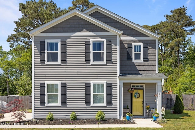 view of front of house featuring fence