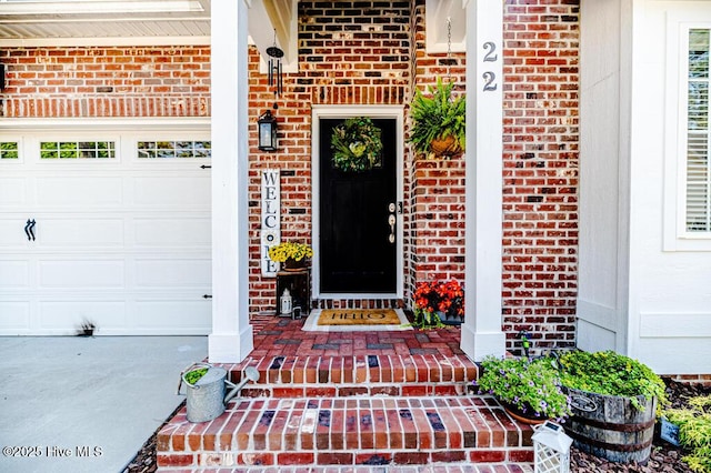 22 Calhoun Ln, Pinehurst, NC 28374 - entrance to property featuring brick siding, a garage, and covered porch