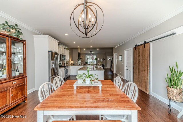 22 Calhoun Ln, Pinehurst, NC 28374 - dining space with dark wood-style flooring, a barn door, a chandelier, baseboards, and crown molding