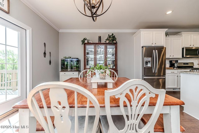 22 Calhoun Ln, Pinehurst, NC 28374 - dining area with healthy amount of natural light, a chandelier, recessed lighting, ornamental molding, and wood finished floors