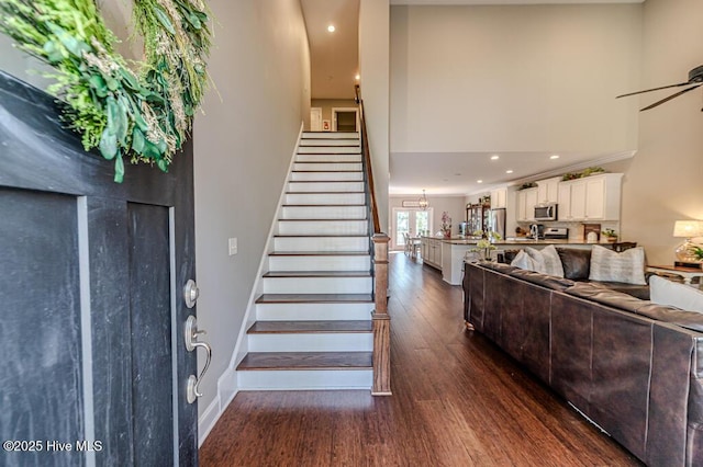 22 Calhoun Ln, Pinehurst, NC 28374 - foyer entrance with dark wood finished floors, stairway, ceiling fan, baseboards, and recessed lighting