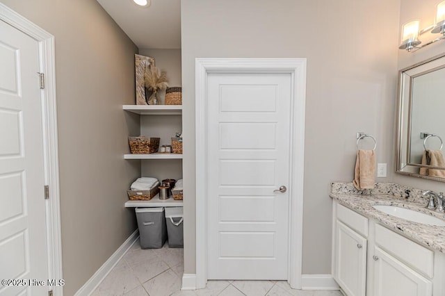 22 Calhoun Ln, Pinehurst, NC 28374 - bathroom with vanity, baseboards, marble look tile flooring, and recessed lighting