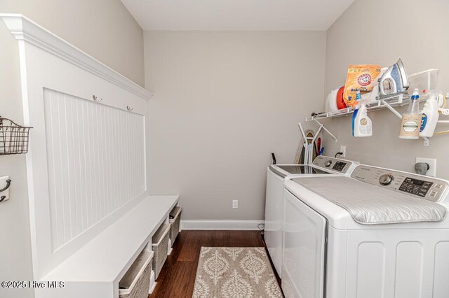 22 Calhoun Ln, Pinehurst, NC 28374 - laundry room featuring washer and clothes dryer, dark wood-type flooring, and baseboards