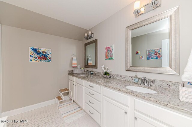 22 Calhoun Ln, Pinehurst, NC 28374 - full bathroom with double vanity and baseboards