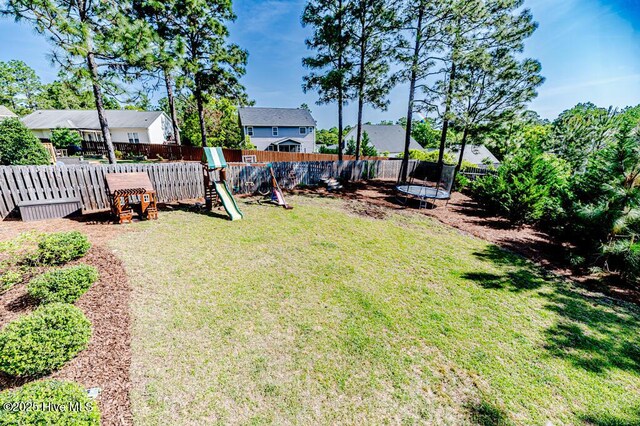 22 Calhoun Ln, Pinehurst, NC 28374 - view of yard with a trampoline, a playground, and a residential view