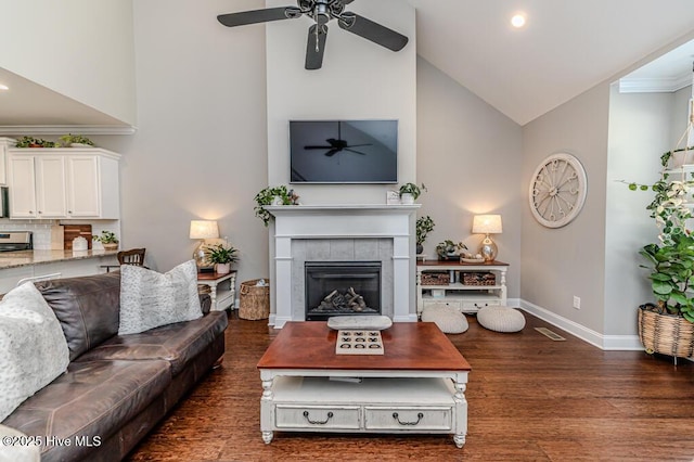 22 Calhoun Ln, Pinehurst, NC 28374 - living room with a ceiling fan, high vaulted ceiling, baseboards, dark wood finished floors, and a tiled fireplace