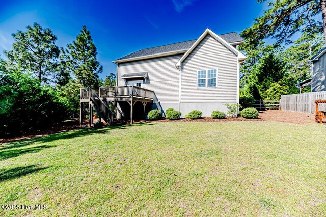 22 Calhoun Ln, Pinehurst, NC 28374 - back of property featuring stairs and a wooden deck