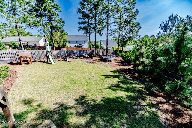 22 Calhoun Ln, Pinehurst, NC 28374 - view of yard featuring a trampoline