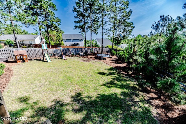 22 Calhoun Ln, Pinehurst, NC 28374 - view of yard featuring a trampoline, a playground, and a residential view