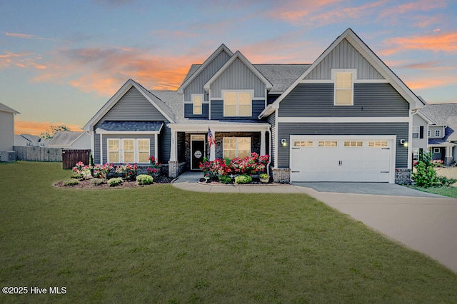 craftsman-style house featuring board and batten siding, concrete driveway, central AC, and a front yard