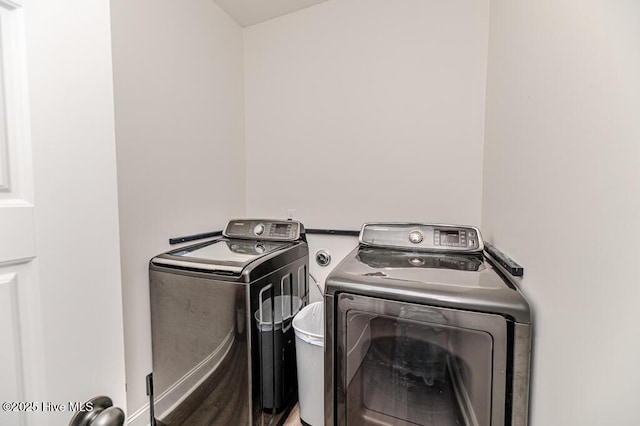 laundry room with separate washer and dryer and laundry area