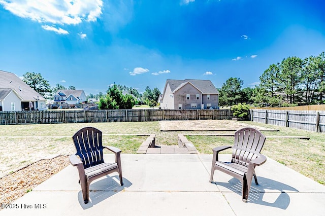 view of patio / terrace with a residential view and a fenced backyard