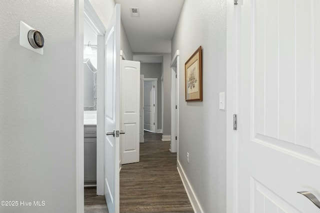 144 Pelican Pointe Dr, Elizabeth City, NC 27909 - hall with baseboards and dark wood-style flooring
