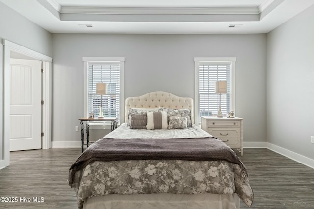 144 Pelican Pointe Dr, Elizabeth City, NC 27909 - bedroom featuring visible vents, crown molding, a tray ceiling, and dark wood finished floors