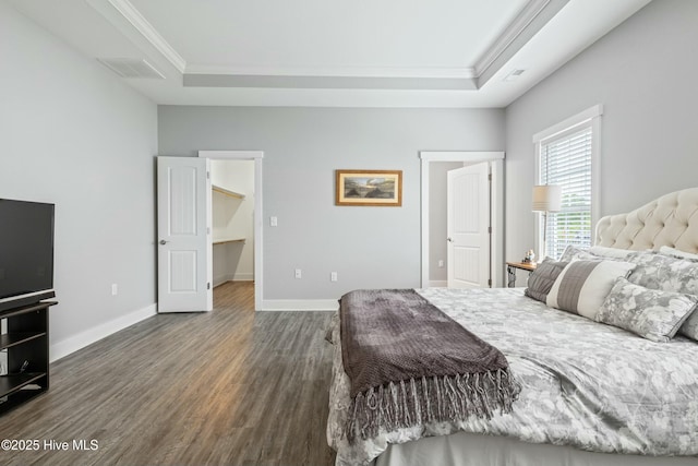 144 Pelican Pointe Dr, Elizabeth City, NC 27909 - bedroom featuring visible vents, wood finished floors, ornamental molding, and a tray ceiling
