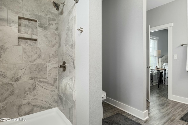 144 Pelican Pointe Dr, Elizabeth City, NC 27909 - bathroom featuring toilet, a tile shower, and wood finished floors