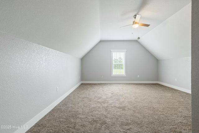 144 Pelican Pointe Dr, Elizabeth City, NC 27909 - additional living space with carpet flooring, ceiling fan, vaulted ceiling, and baseboards