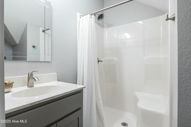 144 Pelican Pointe Dr, Elizabeth City, NC 27909 - full bath with a stall shower, a textured wall, and vanity