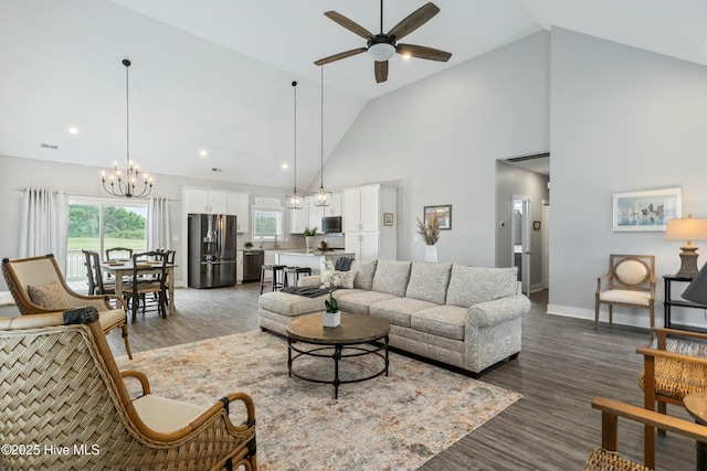 144 Pelican Pointe Dr, Elizabeth City, NC 27909 - living room featuring visible vents, wood finished floors, ceiling fan with notable chandelier, baseboards, and high vaulted ceiling