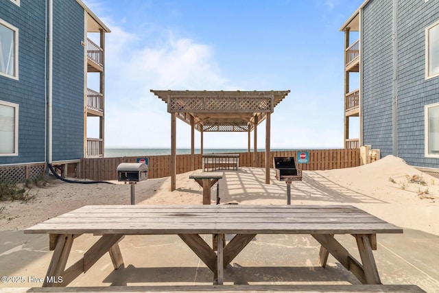 surrounding community featuring a water view