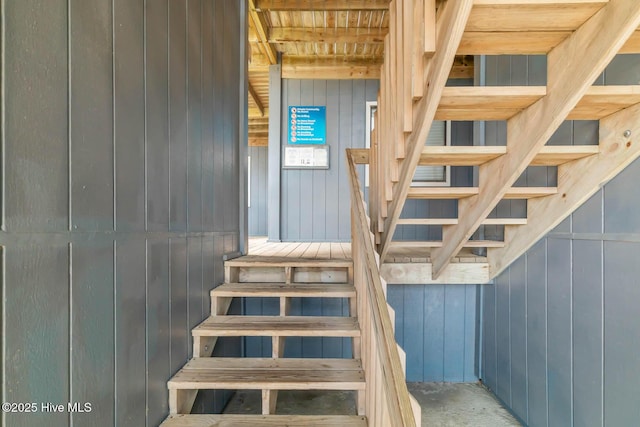 stairs with wood walls