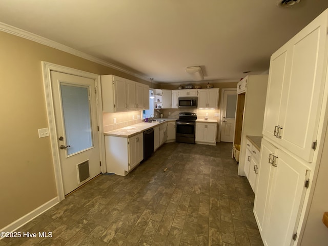 129 Cape Fear Dr, Southport, NC 28461 - kitchen with appliances with stainless steel finishes, ornamental molding, white cabinetry, a sink, and brick patterned flooring