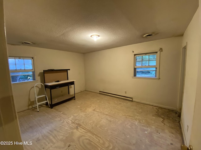 129 Cape Fear Dr, Southport, NC 28461 - unfurnished room with a baseboard radiator and a textured ceiling