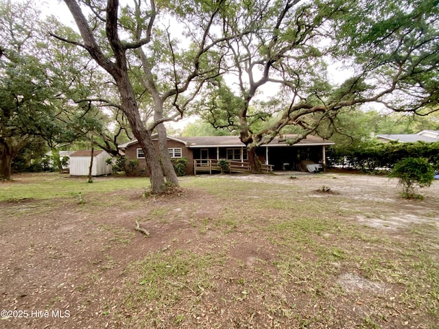 129 Cape Fear Dr, Southport, NC 28461 - back of property with a shed and an outdoor structure