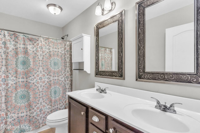 full bath with toilet, double vanity, and curtained shower