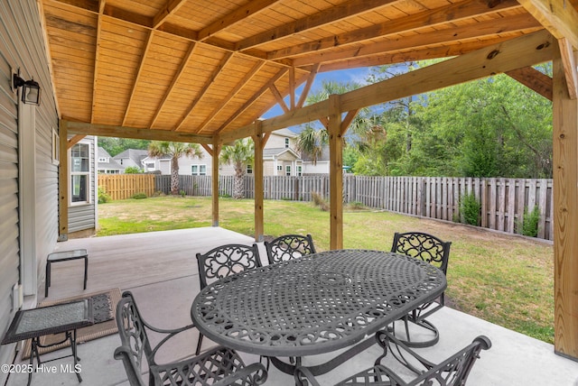 view of patio / terrace with outdoor dining area and a wooden deck