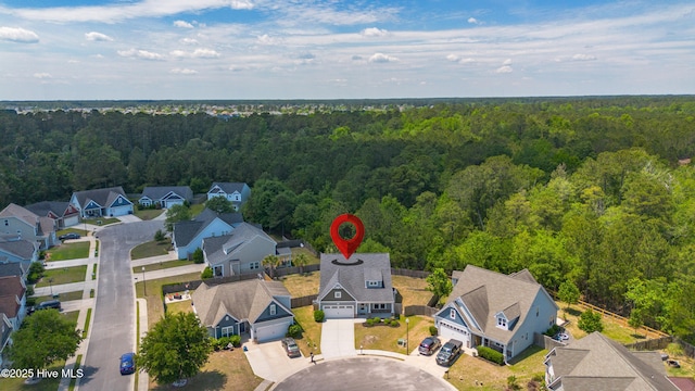 aerial perspective of suburban area with a forest
