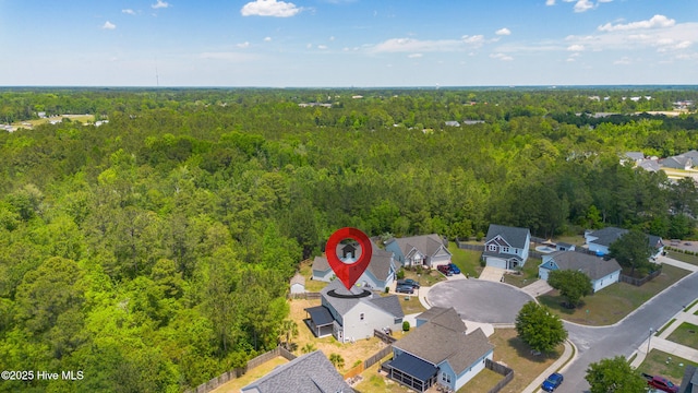 aerial perspective of suburban area with a heavily wooded area