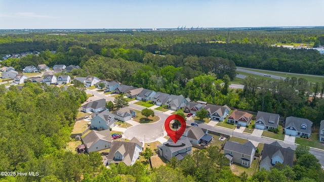 aerial view of residential area with a forest