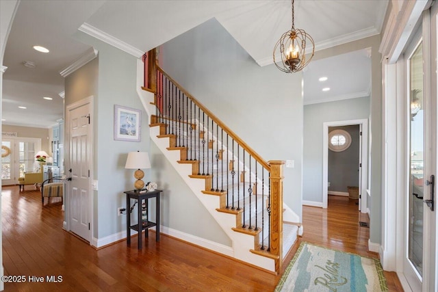 1 Gatha Ln, Ocean Isle Beach, NC 28469 - foyer featuring stairway, baseboards, ornamental molding, and wood finished floors