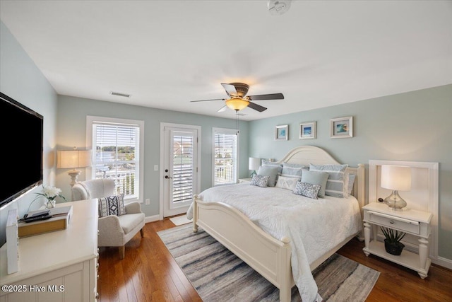 1 Gatha Ln, Ocean Isle Beach, NC 28469 - bedroom with access to exterior, a ceiling fan, baseboards, wood finished floors, and visible vents