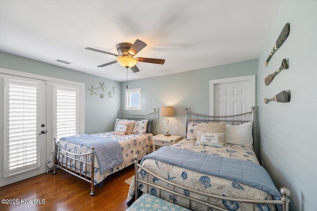 1 Gatha Ln, Ocean Isle Beach, NC 28469 - bedroom with a ceiling fan, visible vents, access to exterior, and wood finished floors