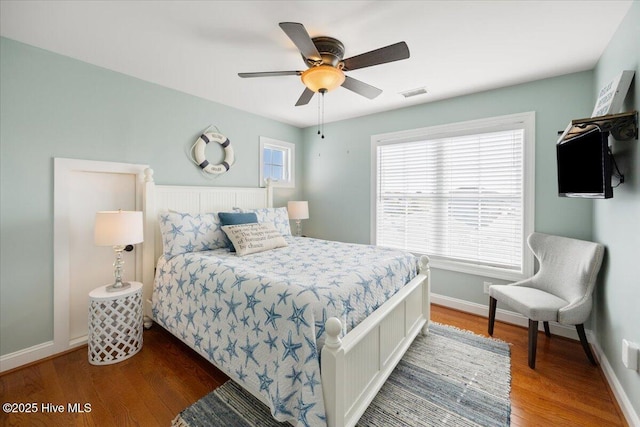 1 Gatha Ln, Ocean Isle Beach, NC 28469 - bedroom featuring a ceiling fan, baseboards, visible vents, and wood finished floors