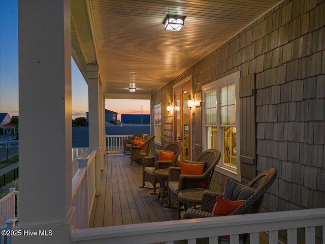 1 Gatha Ln, Ocean Isle Beach, NC 28469 - wooden terrace featuring covered porch