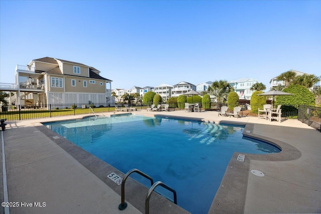 1 Gatha Ln, Ocean Isle Beach, NC 28469 - pool with a patio, fence, and a residential view