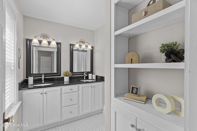 bathroom featuring double vanity and a sink