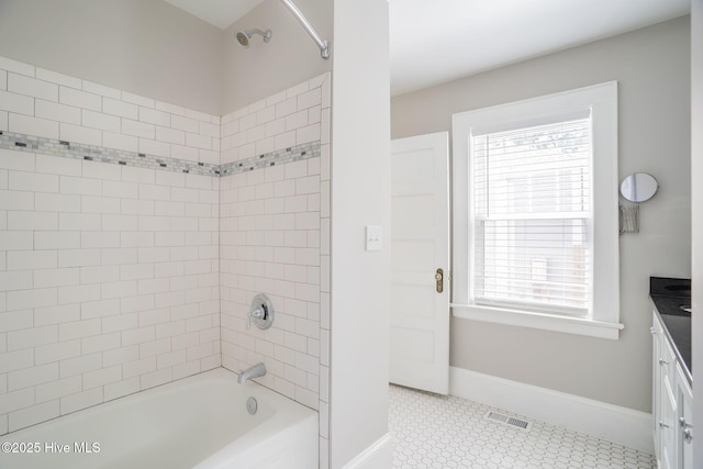 full bathroom featuring visible vents, tile patterned flooring, vanity, tub / shower combination, and baseboards