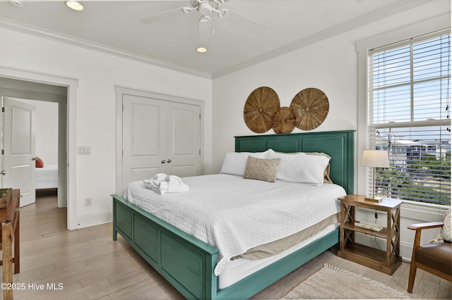bedroom with baseboards, ornamental molding, recessed lighting, and light wood-style flooring