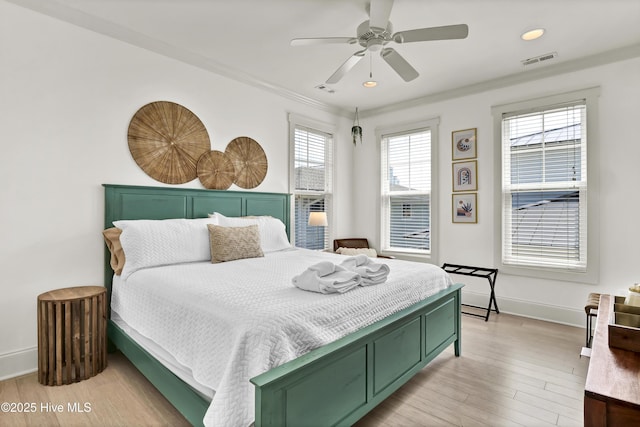 bedroom with visible vents, ornamental molding, baseboards, recessed lighting, and light wood-type flooring
