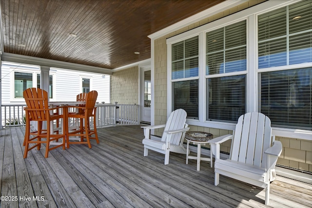 wooden terrace featuring outdoor dining space