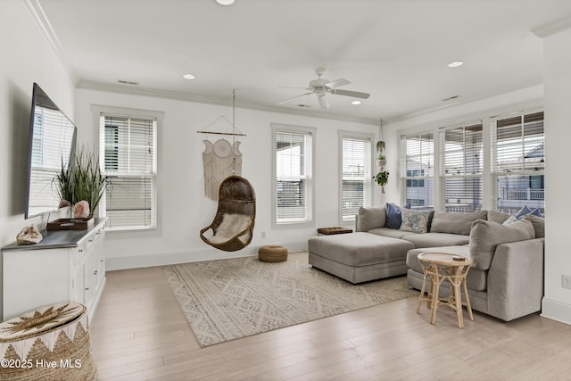 living room featuring crown molding, recessed lighting, ceiling fan, and light wood-type flooring