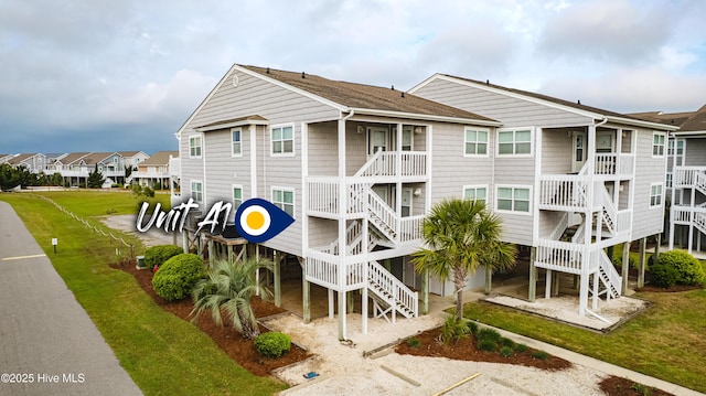 view of building exterior featuring stairway and a residential view