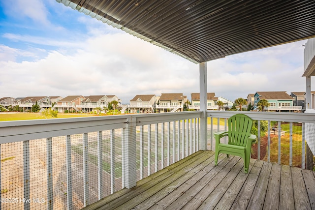 wooden terrace with a residential view