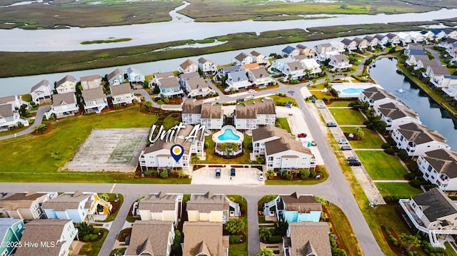 birds eye view of property with a residential view and a water view